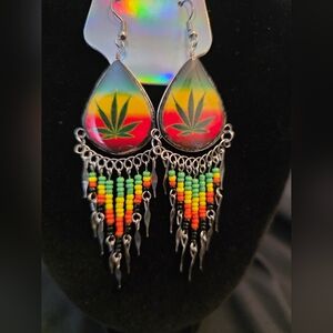 Make a bold statement with these Rasta-inspired pot leaf dangle earrings